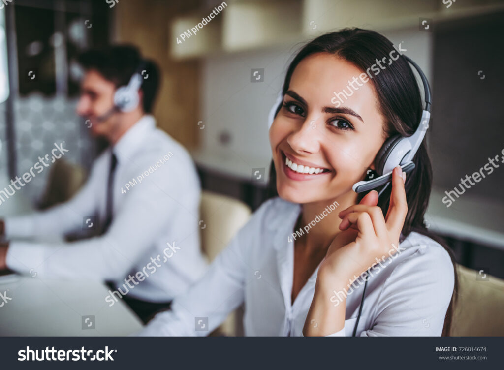 stock-photo-how-can-i-help-you-beautiful-call-center-workers-in-headphones-are-working-at-modern-office-726014674