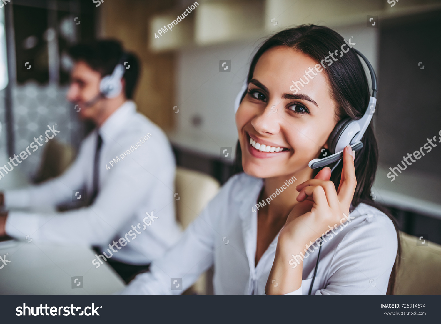 stock-photo-how-can-i-help-you-beautiful-call-center-workers-in-headphones-are-working-at-modern-office-726014674 stock-photo-how-can-i-help-you-beautiful-call-center-workers-in-headphones-are-working-at-modern-office-726014674